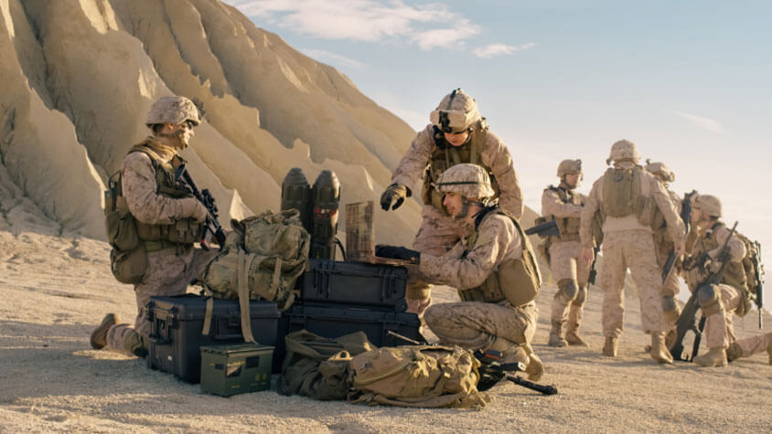 Group of soldiers around supplies