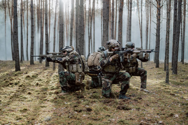 armed soldiers in a combat ready position